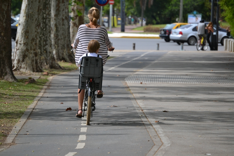 mom with a child on a bike